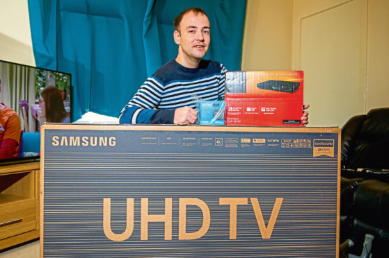 Paul Duncan with some of the raffle prizes.