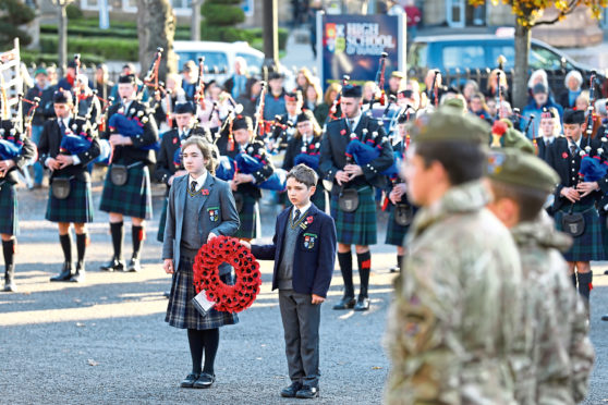 Junior school wreath bearers Freya Galvin and Sam Brass preparing to lay their tribute.
