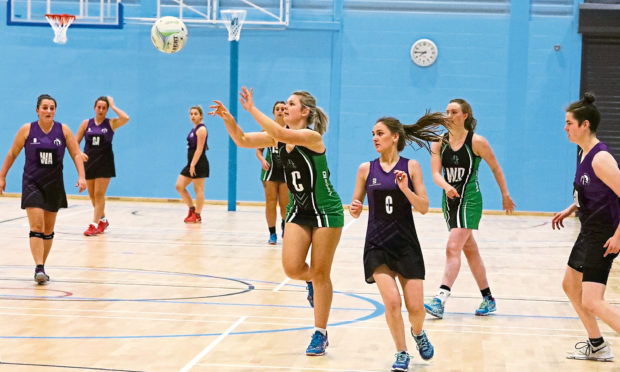 Action from a netball game at the sports centre.