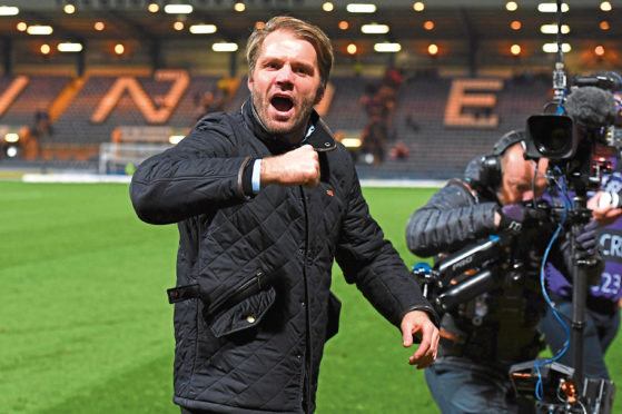 Robbie Neilson celebrates at Dens Park.
