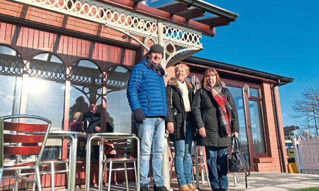 Brother David Fox, sister Isobel and sister-in-law Aileen, along with some of Brian's metalwork at the Bridgeview Station cafe in Dundee.