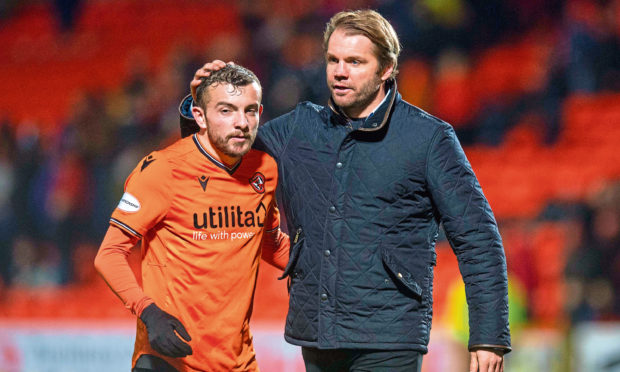 United Manager Robbie Neilson celebrates at full time with Paul McMullan after defeating Queen of the South.