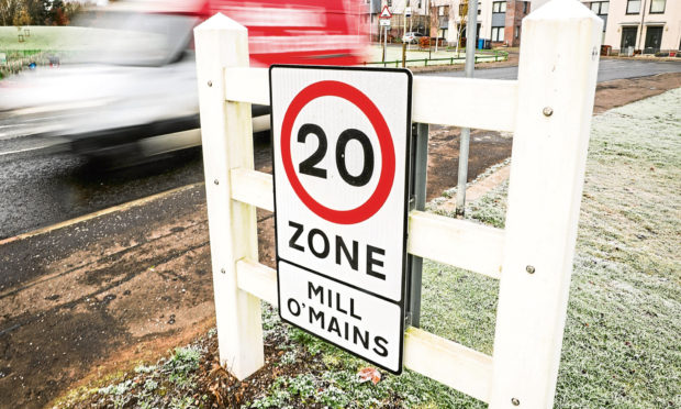Tele News, Dundee story, CR0016561 . Antisocial behaviour and speeding in Mill o Mains, Dundee as people use the estate as a short cut to miss Forfar Road traffic lights. Pic shows; Mill o' Mains estate and cars speeding past 20mph signs. Tuesday, 19th November, 2019. Kris Miller/DCT Media.