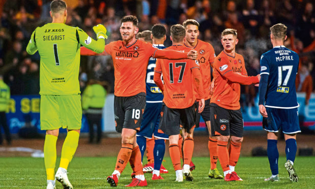 Calum Butcher celebrates at the end of the 2-0 win against Dundee at Dens.