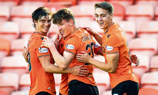 Logan Chalmers, centre, celebrates a goal.