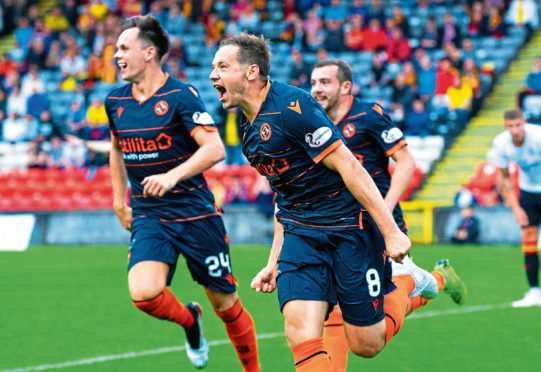 Peter Pawlett wheels away in delight after making it 2-1 to Dundee United.