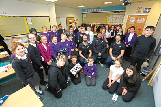 Brett Stovin, Elgin Pearce and Mike Ward Jnr of the Dundee Stars with the P7 pupils.