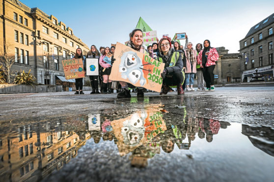 Local pupils Hannah Mackay and Elsie MacDonald taking part in Climate strike protests as part of Extinction Rebellion event in Dundee.