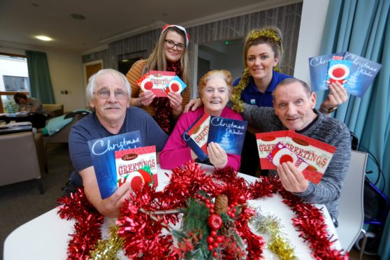 Front (from left) Bob Middleton, Sheena Mitchell and Gordon Anderson, with activities co-ordinators Kirsty Taylor (left) and Shona Preston, at the scheme’s launch.