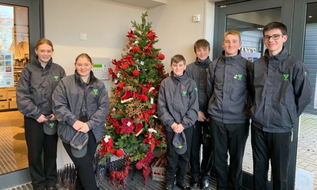 Police Scotland Youth Volunteers in Perth spent the day volunteering with Poppyscotland at Loch Leven's Larder near Kinross on Remembrance Sunday.