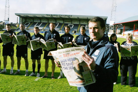 Barry Smith and the squad reading the latest news on the Dark Blues' plight in the Tele in 2010.