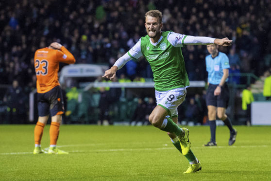 Christian Doidge celebrates after making it 2-1 to Hibernian.
