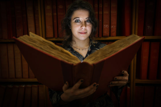 Erin Farley researching her Folklore Collectors lecture at Central Library.