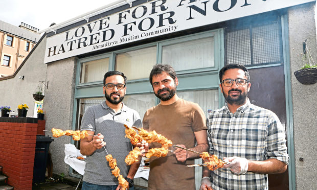 Adeel Ahmad Malih, Fawad Baloch and Adnan Shahzad at a barbecue held by the mosque last year.