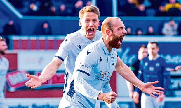 Christophe Berra rushes to congratulate Jordan Forster after his goal against Queen of the South.