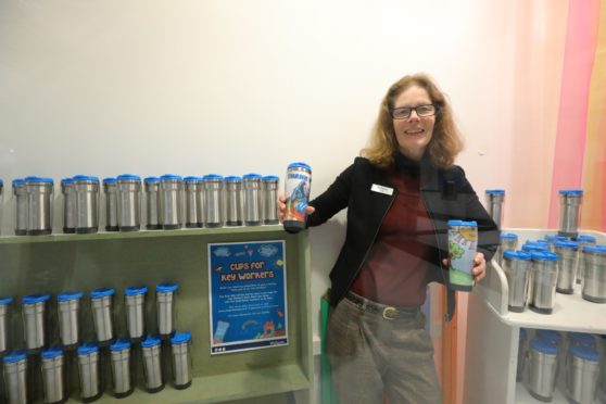 Centre manager, Morag Dennis with the reusable mugs for key workers, which will be designed by school children. (Picture: Dougie Nicolson / DCT Media.)