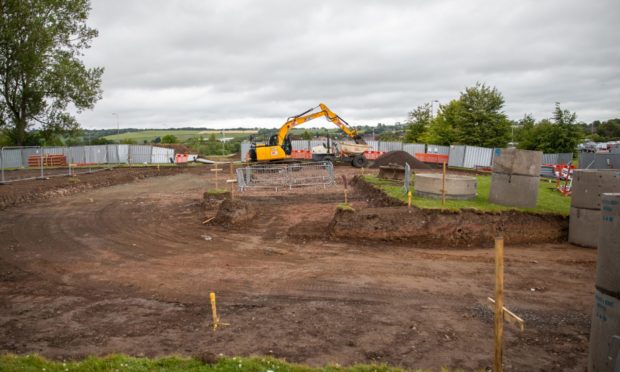 The construction site where the new Starbucks Drive-thru will be located.