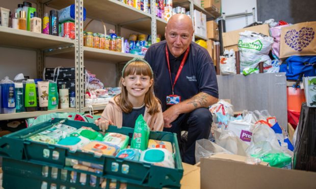 Tam McGeary, janitor at Tayview Primary School and his daughter Erin who has been instrumental in the charity work - he has been organising food, toy, toiletries donations during the pandemic to those in need.