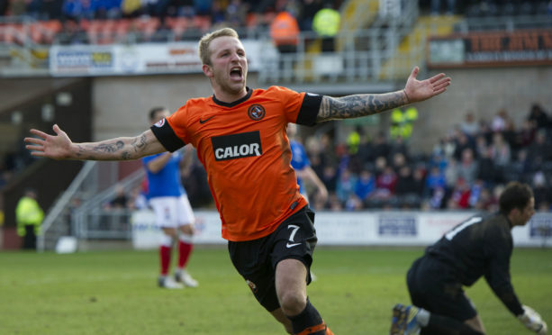 Johnny Russell celebrates scoring for Dundee United against Rangers in 2013.