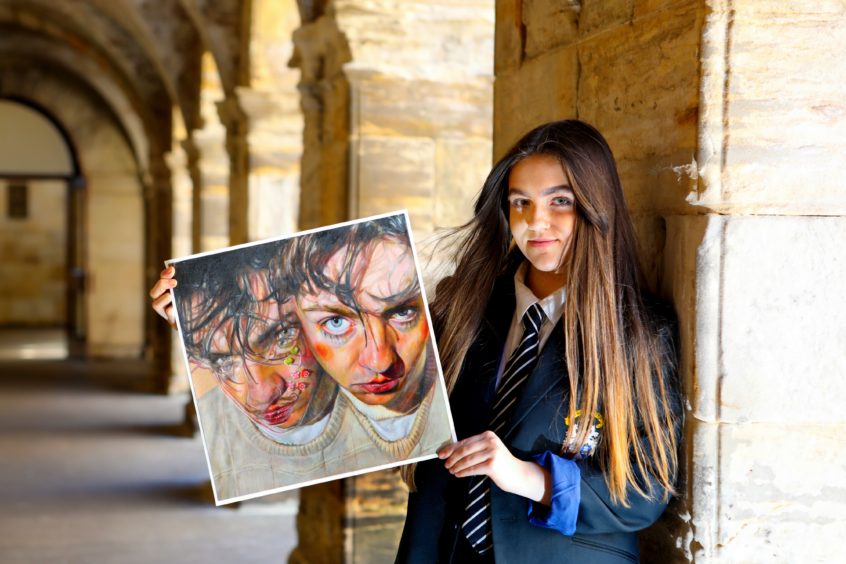 Sixteen-year-old Madras College student Amy McLean with her painting entitled " Jack" which has been long listed for the Scottish Portrait of the Year 2020
