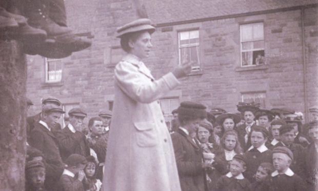 A suffragette, believed to be Adela Pankhurst - daughter of Emmeline - at an open-air meeting in Perth in 1908.