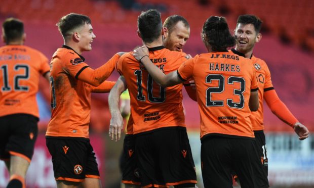 Dundee United players celebrate second goal against Ross County on Saturday.