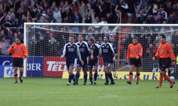 Players' faces tell the story after Claudio Caniggia's goal put Dundee ahead in the city derby in 2000.