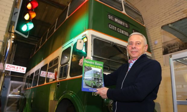 Derek Simpson shows off his new book.