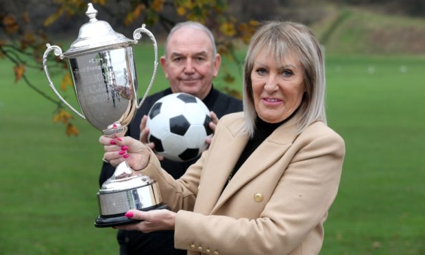 Peter Marr brings back the Zamoyski Trophy in memory of Dave Young to be competed by the Dundee Walking Football League. Peter Marr & Sandra Young (Dave's wife) with the trophy.