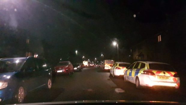 Police vehicles in Helmsdale Avenue.