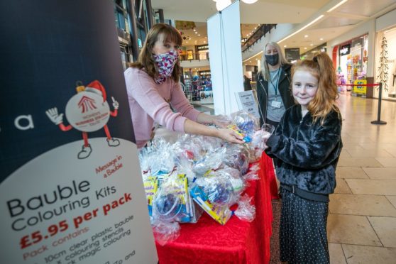 Angie De Vos, Paige Jackson, 9, and Stacey Wallace at Overgate Shopping Centre.
