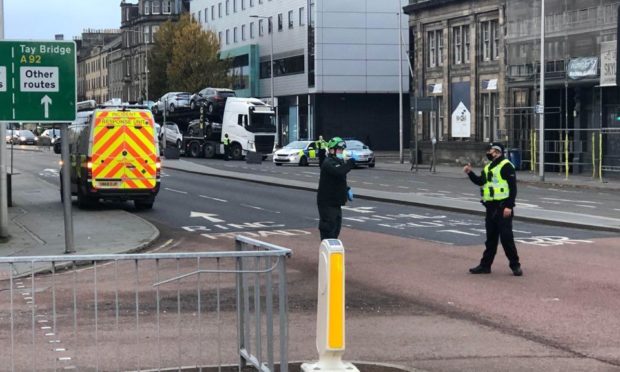 Police and the ambulance service at the scene yesterday.