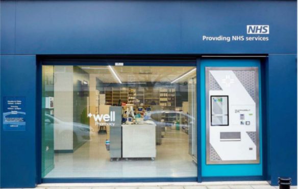 A pharmacy fitted with an automatic prescription dispensing machine.