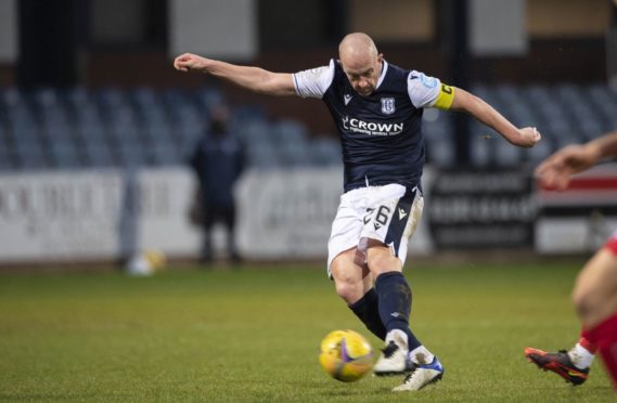 Charlie Adam smashes Dundee in front against Dunfermline but picked up an injury late in the game.
