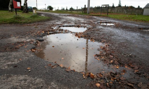 A potholed road in Letham, Angus.