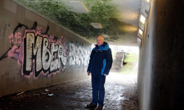 Kevin Keenan said the graffiti-covered under pass must be cleaned.