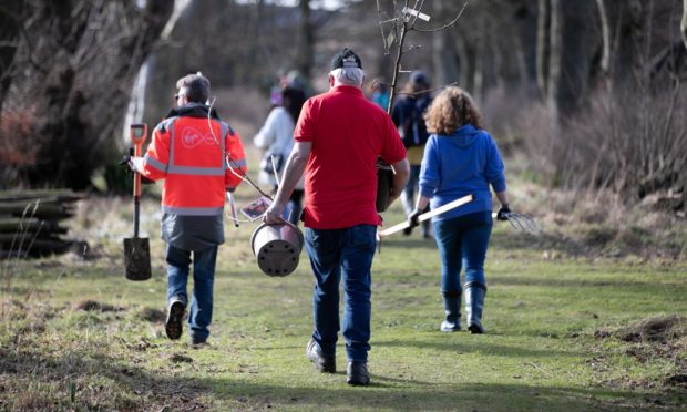 Volunteers taking part in tree planting at Hospitalfield House.