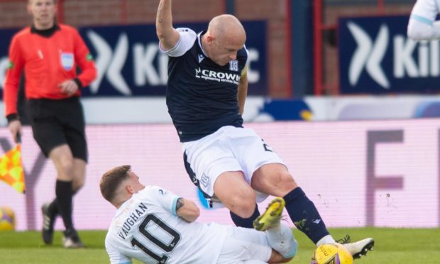 Rovers' Lewis Vaughan challenges Dundee's Charlie Adam.