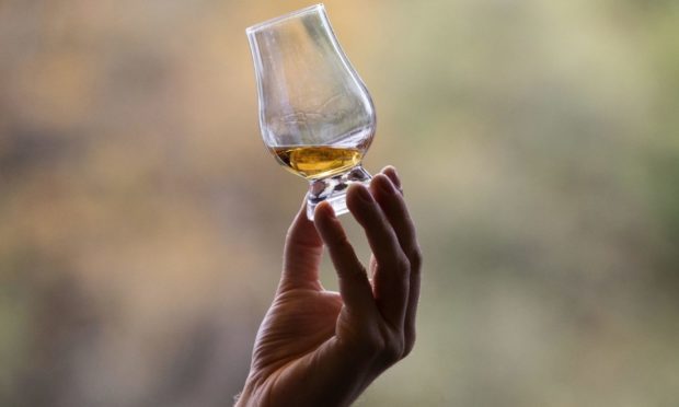 File photo dated 18/10/19 of whisky in a glass. A union has started balloting whisky workers at Chivas Brothers over strike action in response to corporate greed attempts to impose a pay freeze. GMB Scotland said the Chivas parent company Pernod Ricard had awarded pay rises to its workers in France earlier this year. Issue date: Monday April 19, 2021. PA Photo. See PA story INDUSTRY Chivas. Photo credit should read: Jane Barlow/PA Wire