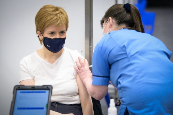 First Minister of Scotland Nicola Sturgeon receiving the first shot of the Astra Zeneca vaccine.