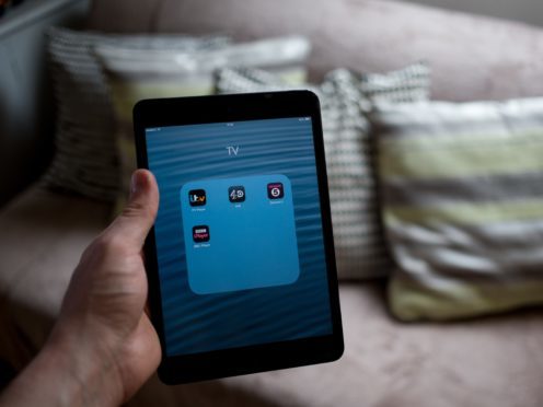 The average person spends 12 hours streaming programmes (Steve Parsons/PA)