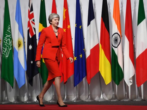 Prime Minster Theresa May arrives for the welcoming session at the G20 Summit in Osaka, Japan.