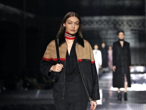 Gigi Hadid has donated a Fenty top and skirt and Dior saddlebag (Aaron Chown/PA)