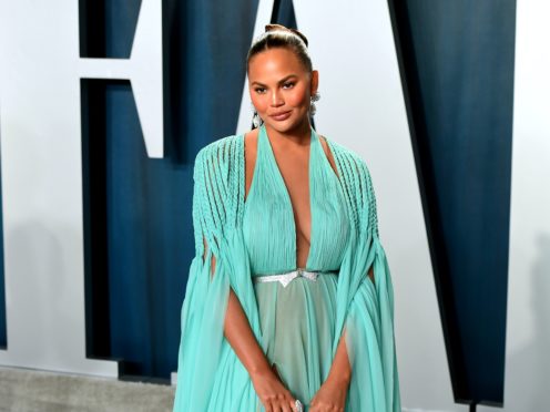 Chrissy Teigen is expecting her third child with Grammy-winning singer John Legend (Ian West/PA)