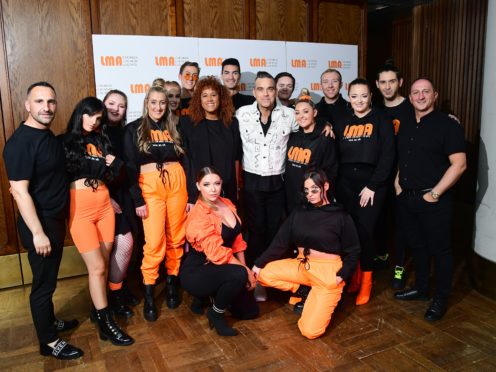 Robbie Williams with the LMA Choir (Ian West/PA)