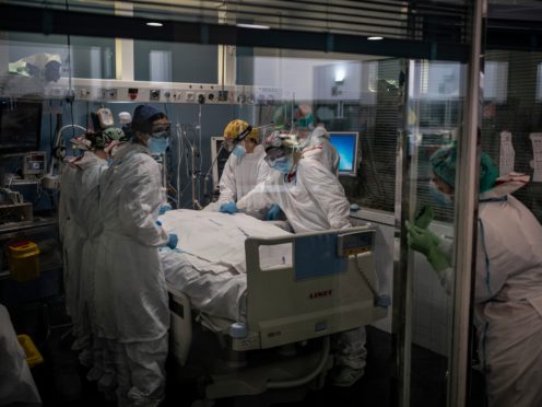 A Covid-19 patient receives treatment in the ICU of the Hospital del Mar in Barcelona, Spain, (Felipe Dana/AP)