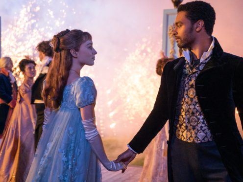 Sparks fly between Daphne, played by Phoebe Dynevor, and the rebellious Duke of Hastings, played by Rege-Jean Page ((Liam Daniel/Netflix/PA)