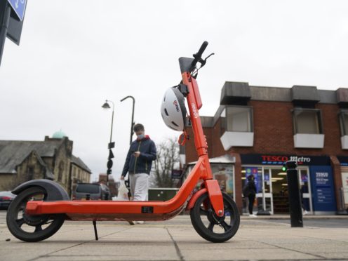 The orange hire scooters are part of a new scheme in Newcastle (Owen Humphreys/PA)