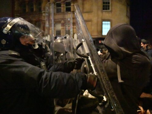 Police officers move in on demonstrators in Bristol during the ‘Kill The Bill’ protest against The Police, Crime, Sentencing and Courts Bill (Ben Birchall/PA)