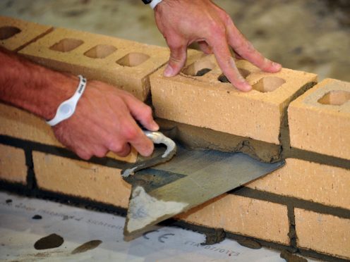 A trainee bricklayer at work (Ian Nicholson/PA)